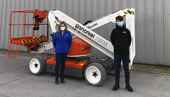 PB Machine Tech Managing Director, Lily Holmes receives the Snorkel A38E from Sean Hopkins, Field Sales Representative, Ahern Ireland